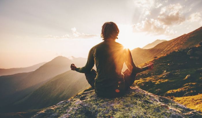 Meditating peaceful sunrise stocksy Meditating peaceful sunrise stocksy